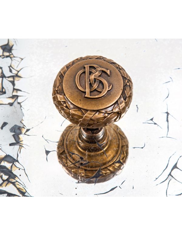 original late 19th century ornamental cast bronze monogrammed doorknob from holabird and roche's old colony building 