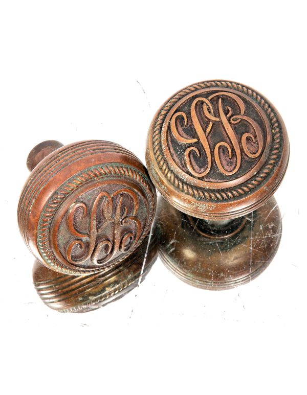 late 19th century original ornamental cast brass commercial building monogrammed doorknobs with fanciful lettering 