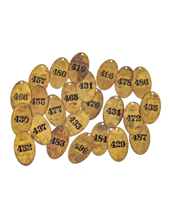 large lot of early 20th century ywca hotel heavy stamped brass guest room door key fobs with black enameled numbers