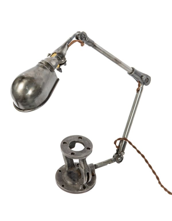 refinished and rewired articulating ball-joint adjustable lamp with cast iron bonnet base for display 