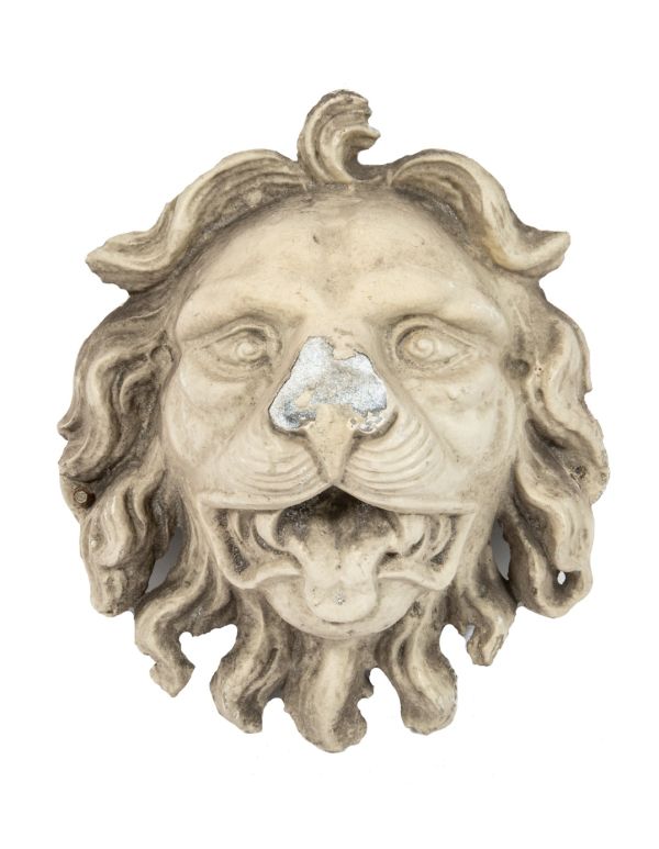 early recast of oversized lionhead used during renovation of george j. johnson's iron block (1860)
