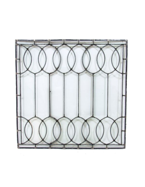 important late 19th century strongly geometric leaded clear glass robert p. parker "bootleg" house window featuring bands of overlapping ovals