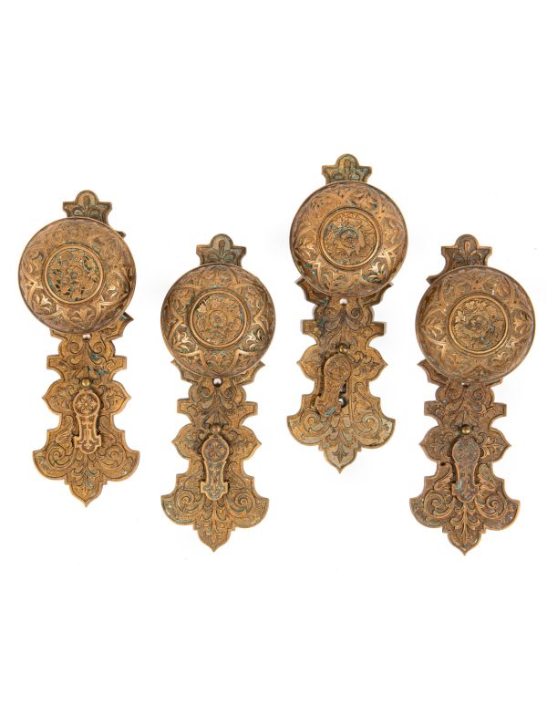 lot of original well-maintained ornamental cast bronze mccc/re matching doorknobs and backplates with swinging keyhole covers 