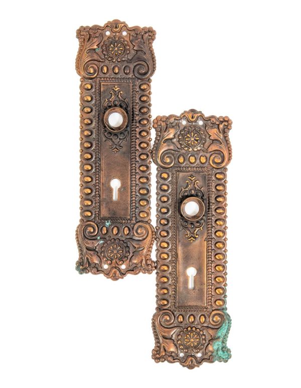 two matching all original late 1890s ornamental wrought bronze salvaged chicago doorknob backplates 