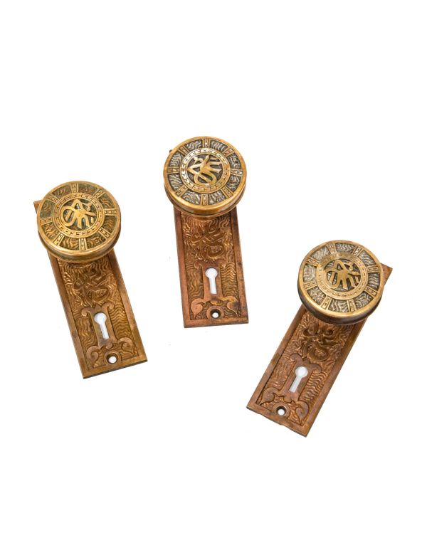 group of three matching original 19th century ornamental cast brass "arabic" pattern passage door hardware