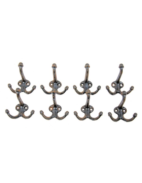 large lot of original early 20th century cast iron salvaged chicago schoolhouse hooks with acorn finials 