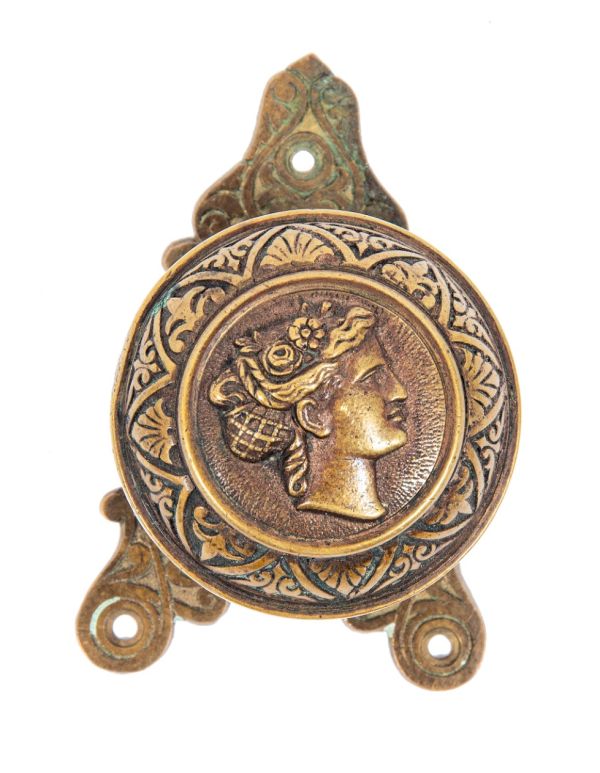 1870s cast bronze "goddess diana" residential banded rim figural doorknob with matching triangular-shaped backplate 