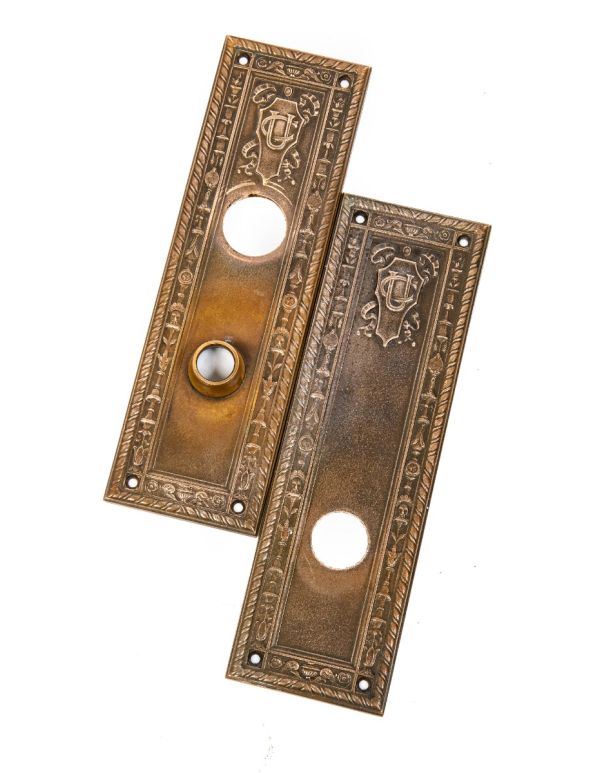 two matching cast bronze union central life insurance company building doorknob backplates designed by cass gilbert