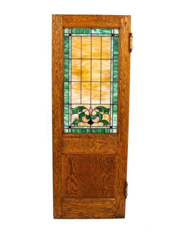 one of two matching custom-designed early 20th century oak and stained glass chicago funeral parlor swinging doors