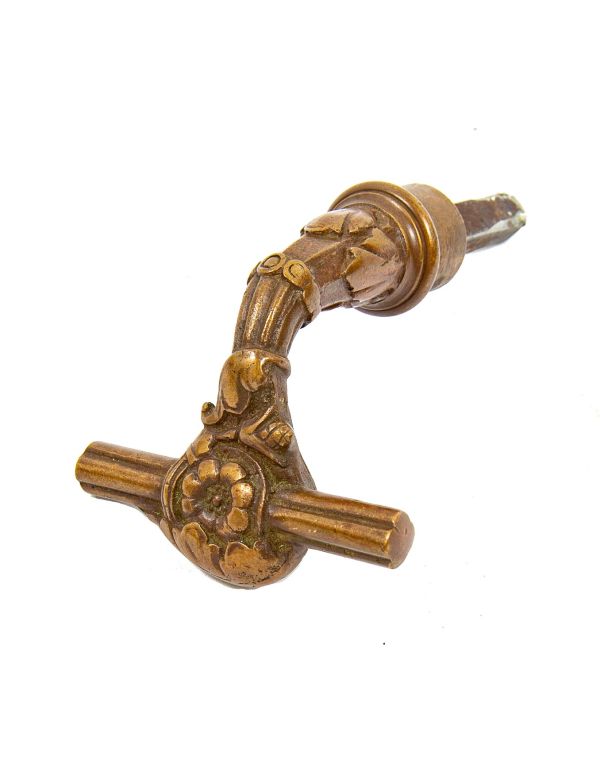 victorian era ornamental cast bronze t-handle style knob hardware manufactured for the metallic compression casting co., in boston, ma.