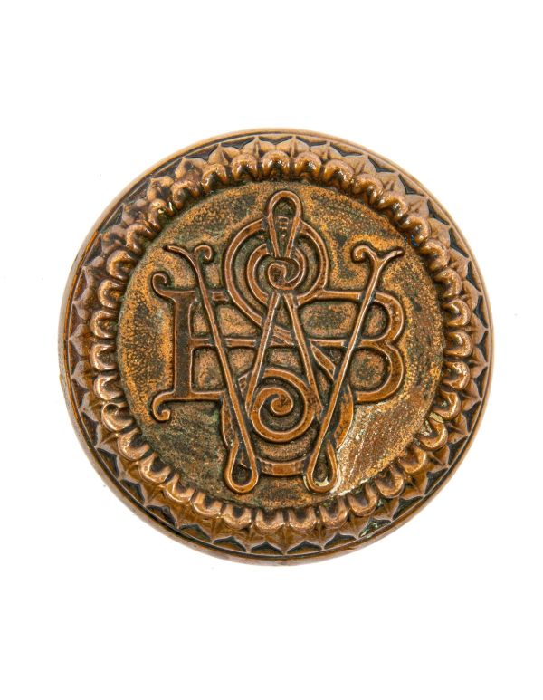 rare and highly sought after 1870s metal compression custom-designed monogrammed building doorknob