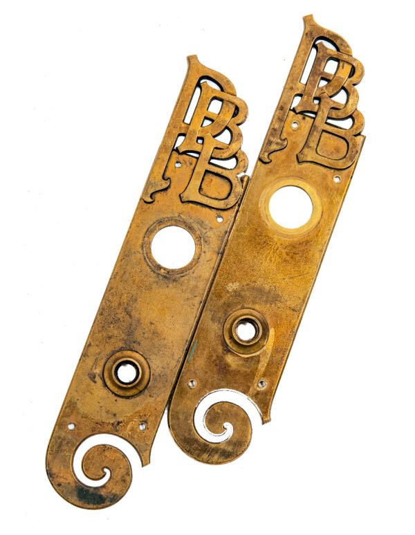 matching pair of unusual late 19th century monogrammed cast brass american commerical building office door backplates 