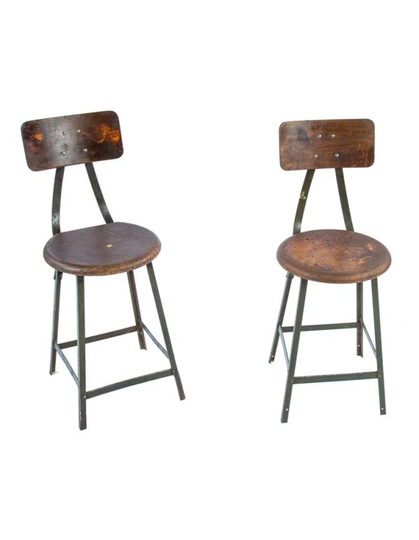 two matching original c. 1940's american industrial angled steel chicago factory machine shop four-legged stools with "pollard green" enameled finish 