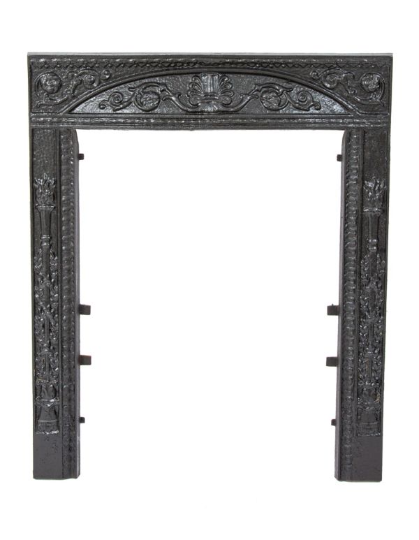 19th century salvaged chicago dawson brothers ornamental cast iron fireplace surround with black enameled finish 