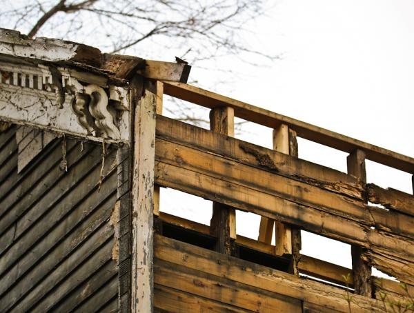 a closer look at a controversial old town "rotted" post fire 19th century workers cottage