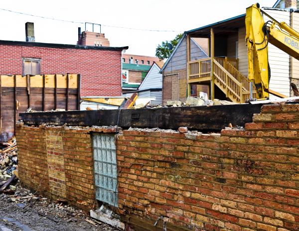 demolition of a brick workers cottage at 1111 n. campbell reveals sill plates, summer beams and faceted pegs