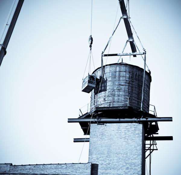 early 20th century water tank plucked off goldblatt building to make way for replica in 2018