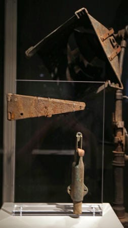 Phil Velasquez / Chicago Tribune The lamp (top right), door hinge and spring-loaded door stop from the Iroquois Theatre. The lamp caught fire during a performance in 1903, the hinges and door stops kept people in the theater from escaping, as a result 600 people died.