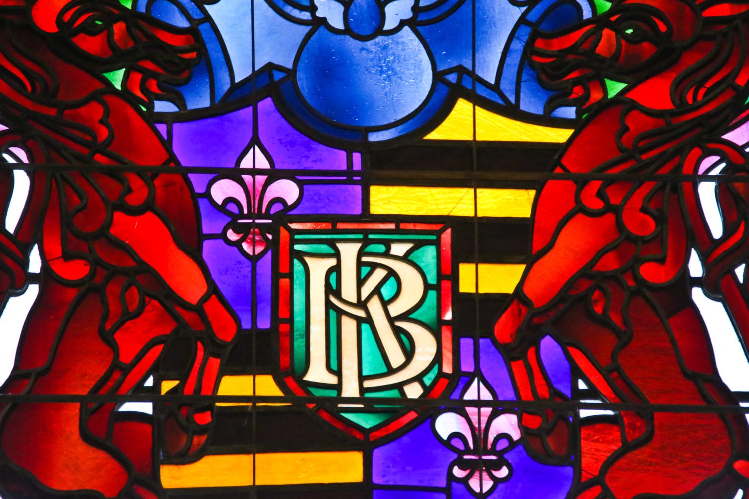 detail of the richly colored balaban & katz's "coat of arms" with rearing lions and film reel